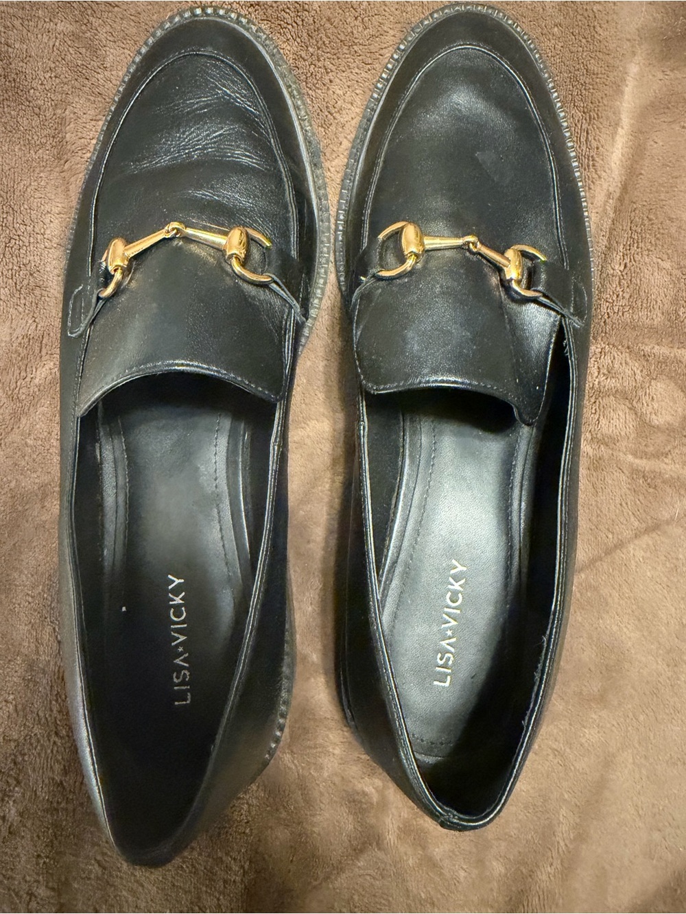 LISA VICKY Black Leather Slip-On Loafers with Gold Hardware